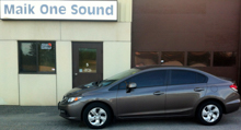 Grey 2013 Honda Civic with dark privacy window tint